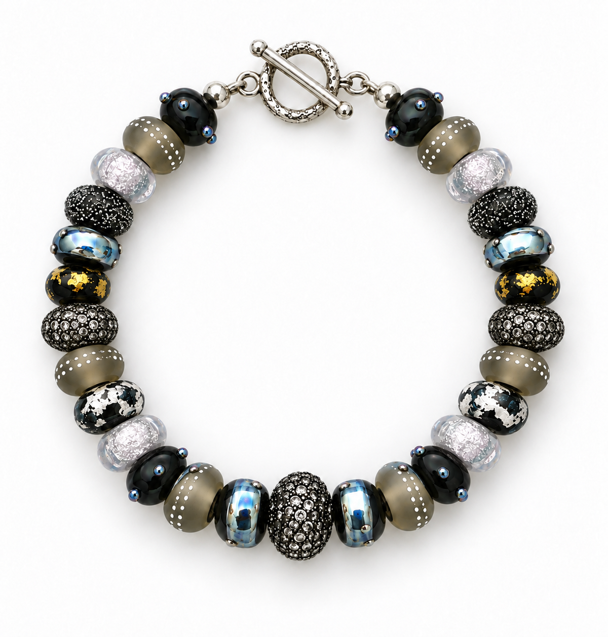 Silver Smoke beaded bracelet arranged in a circle on white, showing patterned black and gray beads, metallic accents and a silver-tone toggle clasp | Bliss by Cori