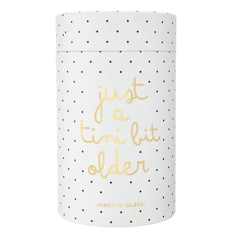 White polka dot cylindrical gift tube with gold foil just a tini bit older cursive script and Martini Glass label on white background – Bliss by Cori
