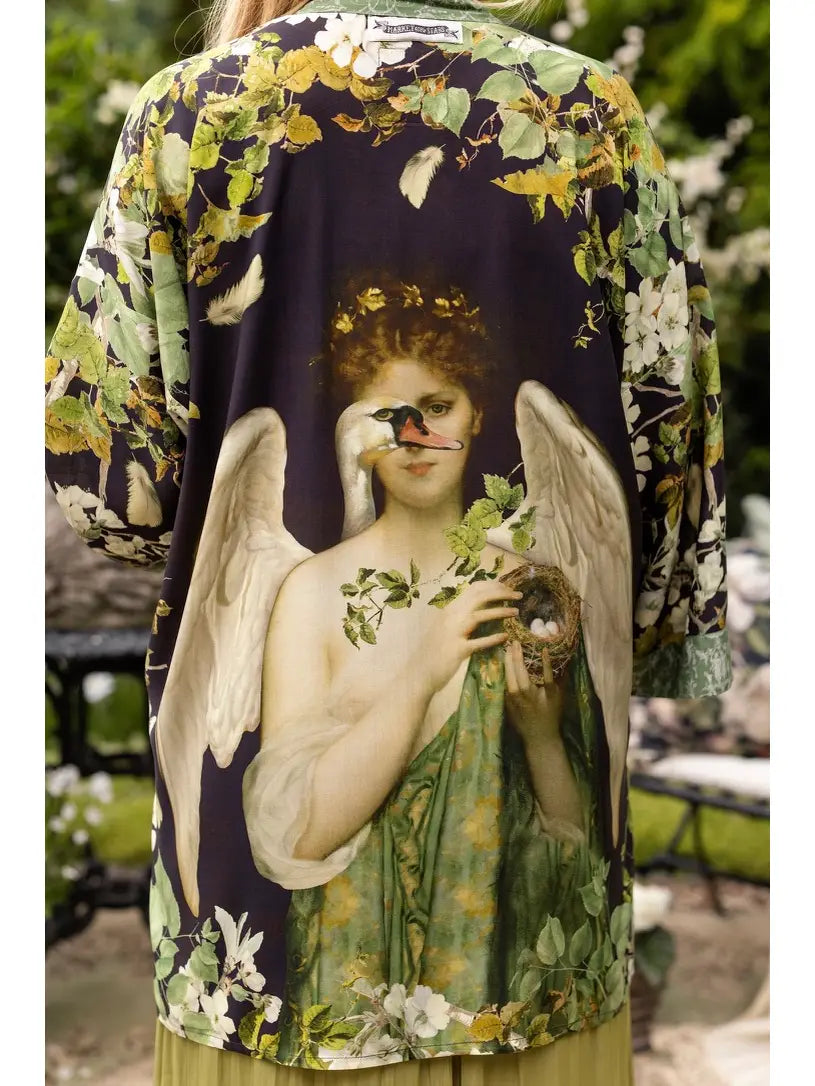 Back view of a model wearing the black, green and ivory Equinox botanical duster outdoors | Bliss by Cori