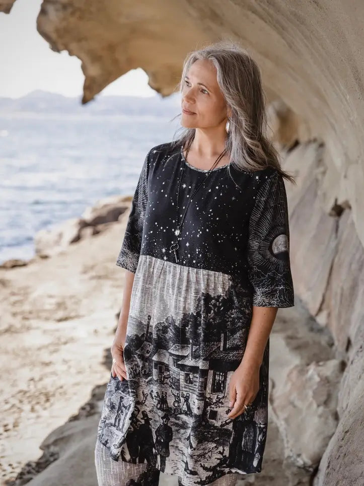 Front portrait of woman in Stargazer Artist Dress in sandstone cave with hands in pockets — celestial print shift dress with pockets | Bliss by Cori Boutique