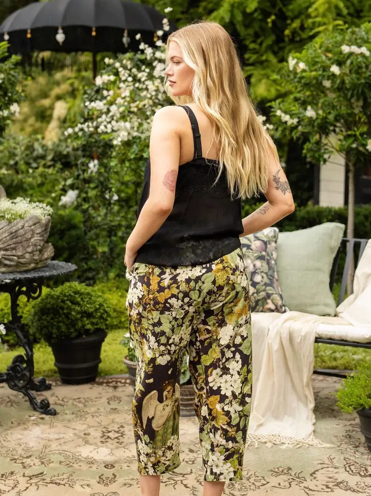 Back view of the Equinox linen-viscose Artist Pants styled with a black tank top outdoors | Bliss by Cori